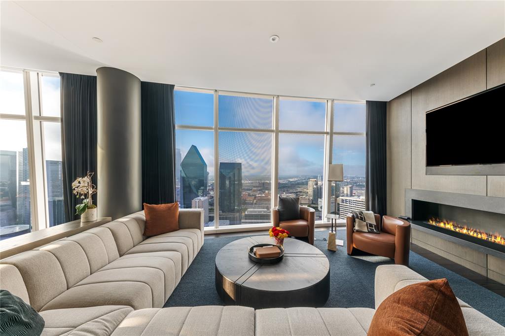 1918 Olive Street, Unit 3403 Dallas, TX 75201 - Photo 14 of 39 a living room with furniture and a flat screen tv