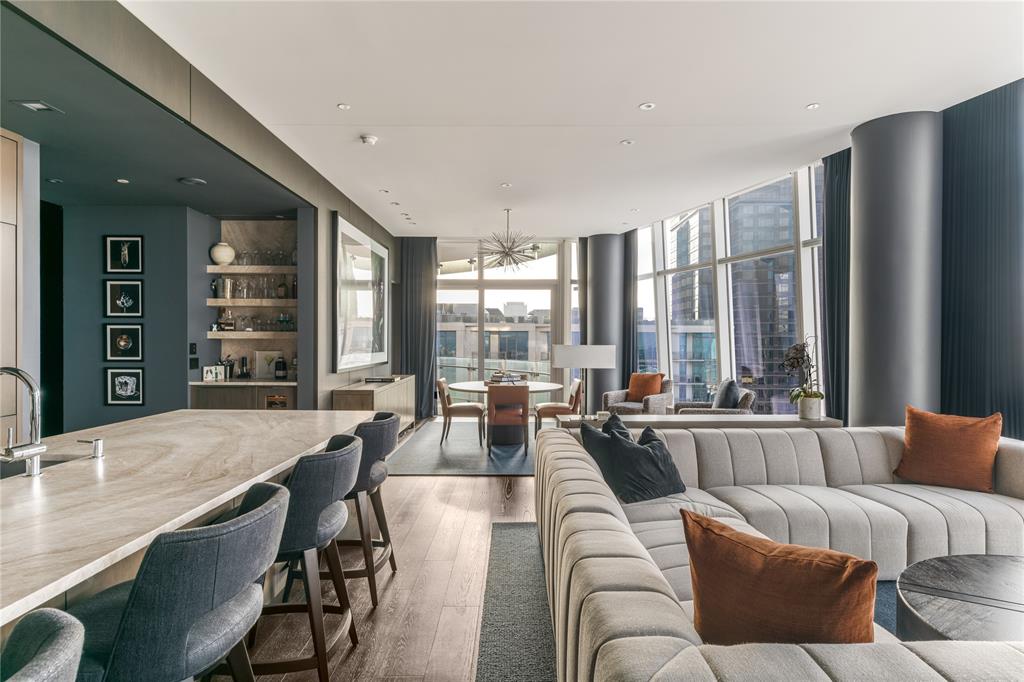 1918 Olive Street, Unit 3403 Dallas, TX 75201 - Photo 16 of 39 a living room with furniture and large windows