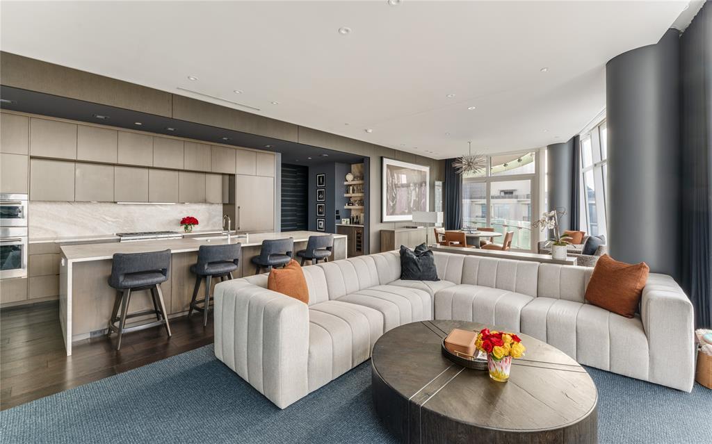 1918 Olive Street, Unit 3403 Dallas, TX 75201 - Photo 17 of 39 a living room with furniture and a wooden floor