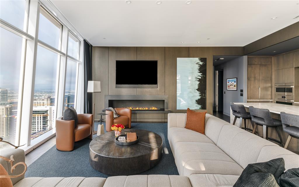 1918 Olive Street, Unit 3403 Dallas, TX 75201 - Photo 2 of 39 a living room with furniture and a flat screen tv