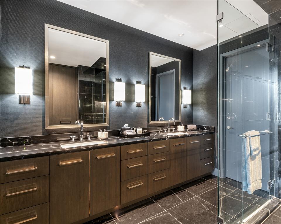 1918 Olive Street, Unit 3403 Dallas, TX 75201 - Photo 23 of 39 a bathroom with a granite countertop sink a large mirror and a