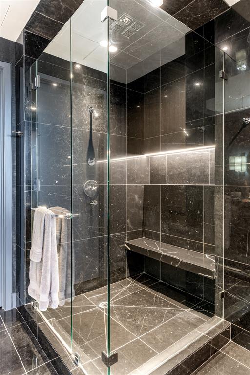 1918 Olive Street, Unit 3403 Dallas, TX 75201 - Photo 26 of 39 a bathroom with a glass shower door