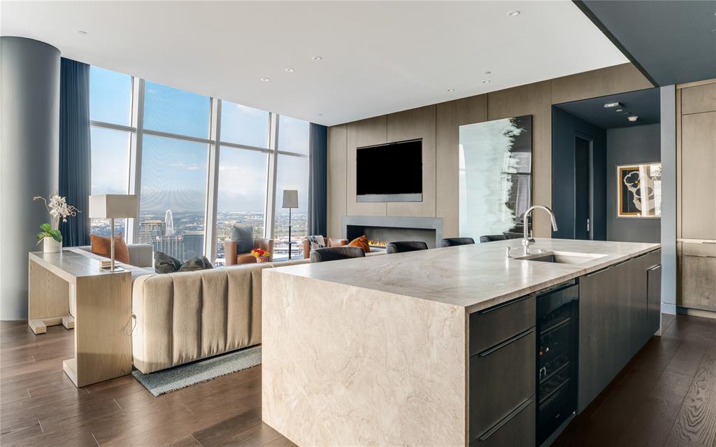 1918 Olive Street, Unit 3403 Dallas, TX 75201 - Photo 3 of 39 a large white kitchen with a large window and sink