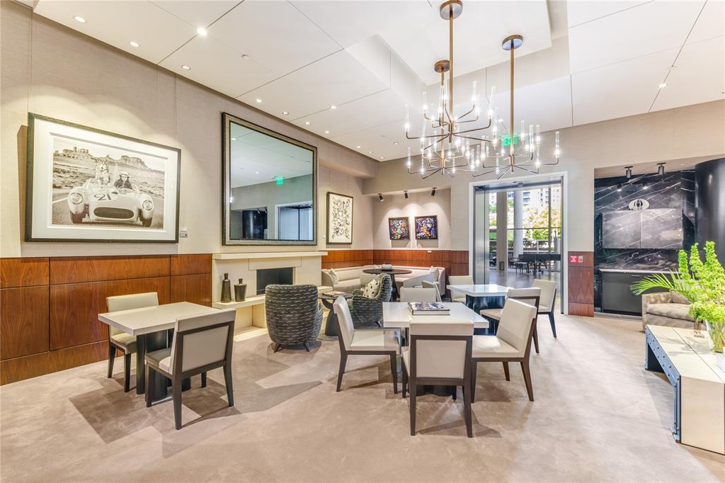 1918 Olive Street, Unit 3403 Dallas, TX 75201 - Photo 33 of 39 a view of a dining room with furniture a chandelier and wooden floor