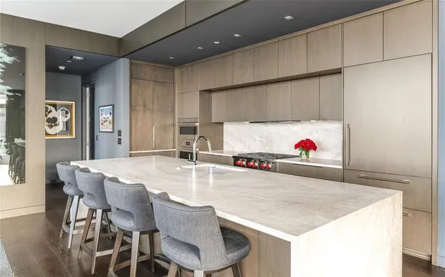 a kitchen with a table and chairs in it