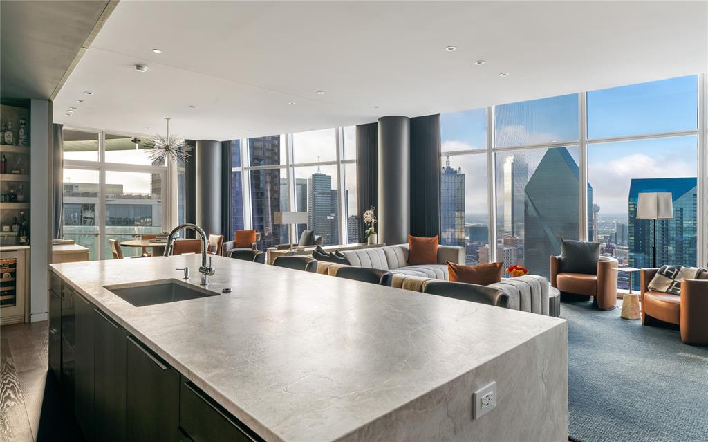 1918 Olive Street, Unit 3403 Dallas, TX 75201 - Photo 7 of 39 a large kitchen with kitchen island a large window in it