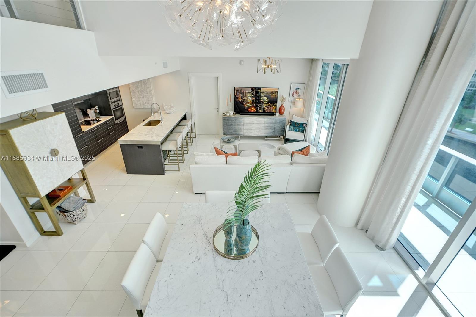 200 Biscayne Blvd Way, Unit 505 Miami, FL 33131 - Photo 12 of 51 a living room with furniture and a flat screen tv