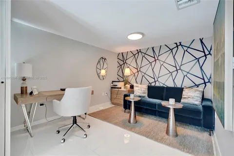 a view of a livingroom with furniture and lounge chair