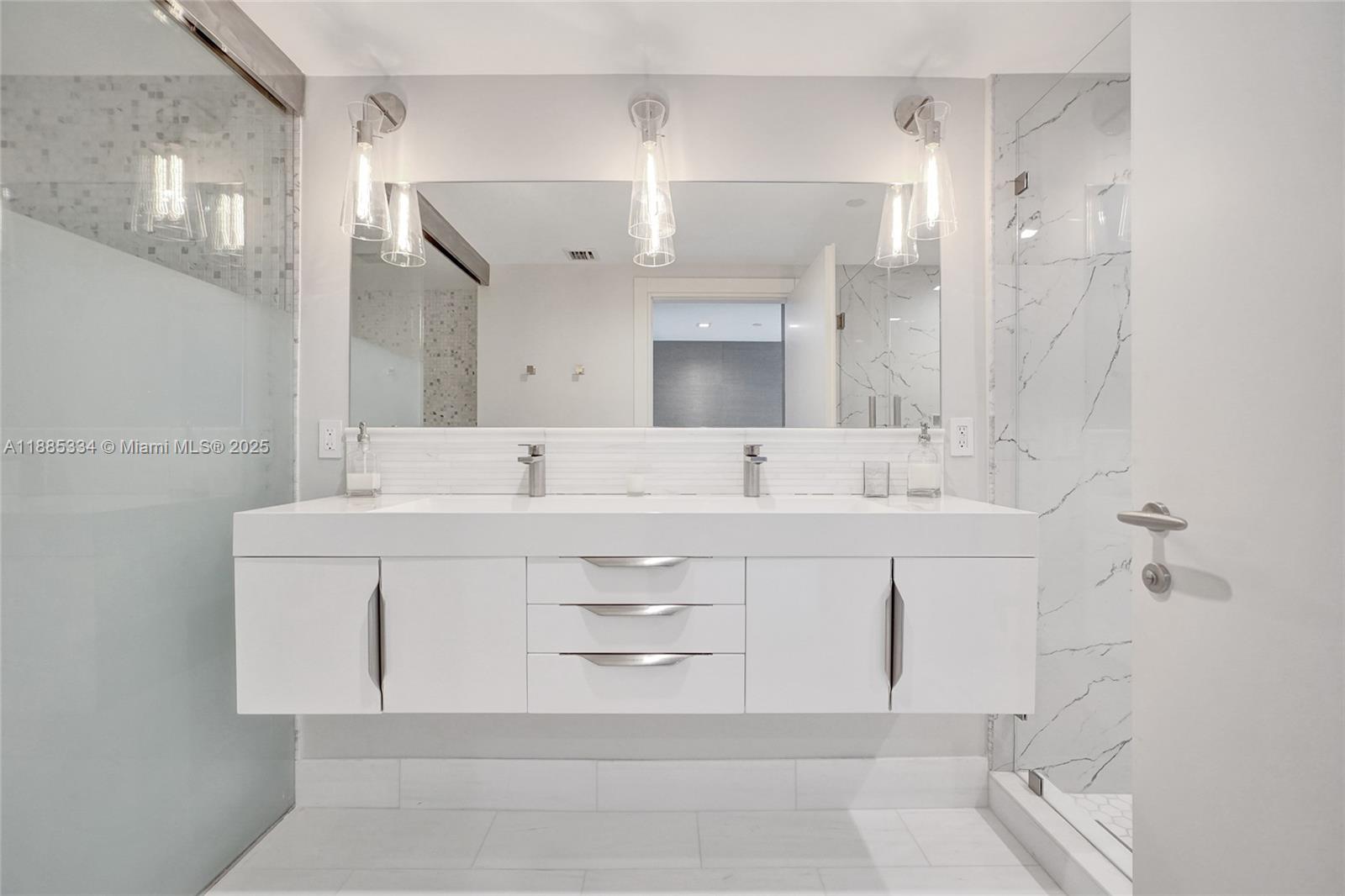 200 Biscayne Blvd Way, Unit 505 Miami, FL 33131 - Photo 25 of 51 a bathroom with a sink mirror and a bath tub