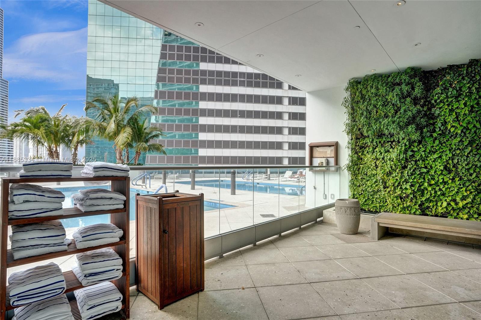 200 Biscayne Blvd Way, Unit 505 Miami, FL 33131 - Photo 45 of 51 a view of a patio with table and chairs and potted plants
