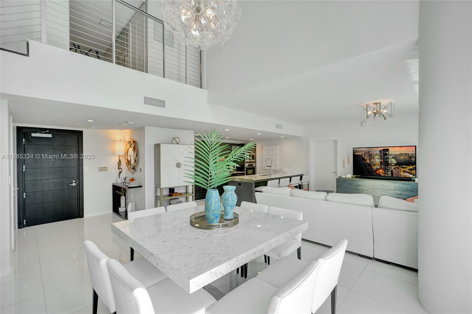 200 Biscayne Blvd Way, Unit 505 Miami, FL 33131 - Photo 6 of 51 a view of a dining room with furniture and wooden floor