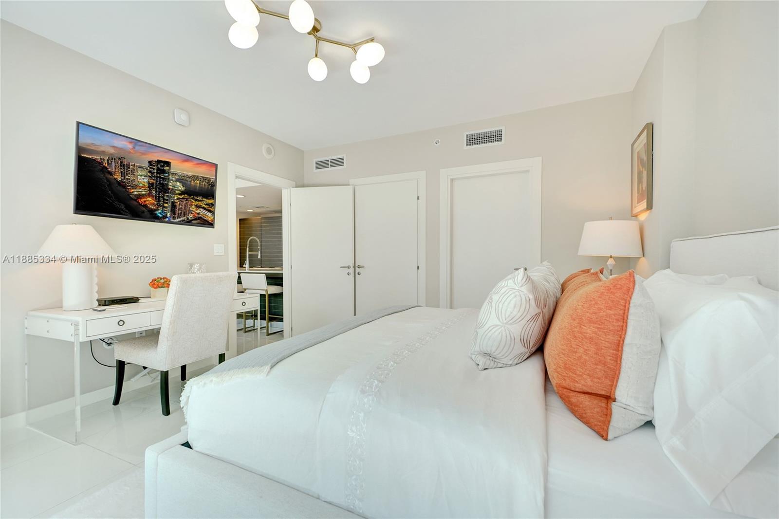 200 Biscayne Blvd Way, Unit 505 Miami, FL 33131 - Photo 10 of 51 a bedroom with a bed and a flat screen tv