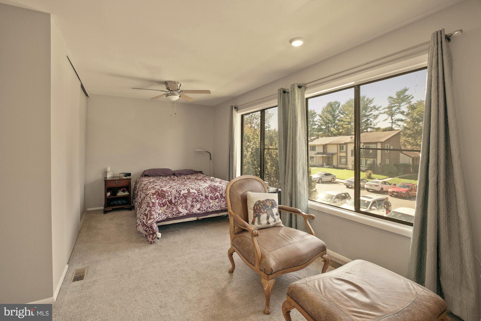 9122 Centerway Road Gaithersburg, MD 20879 - Photo 19 of 33 a bedroom with furniture and a window