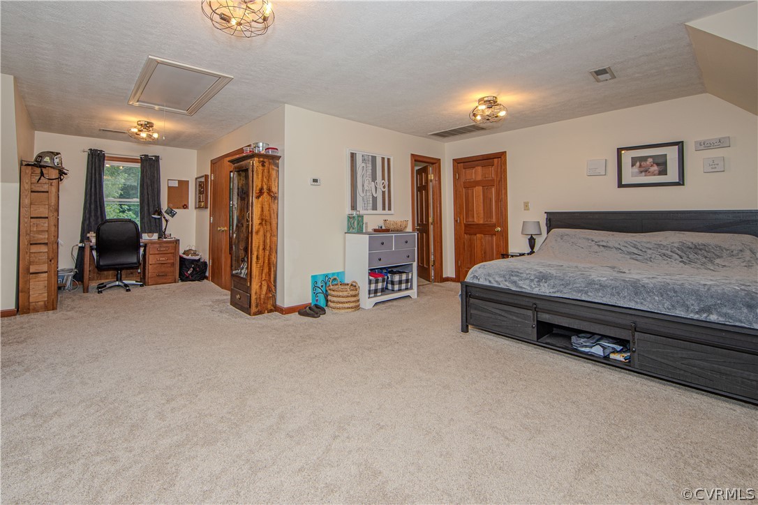 9910 Colemans Lake Road Ford, VA 23850 - Photo 15 of 33 a bedroom with bed and furniture
