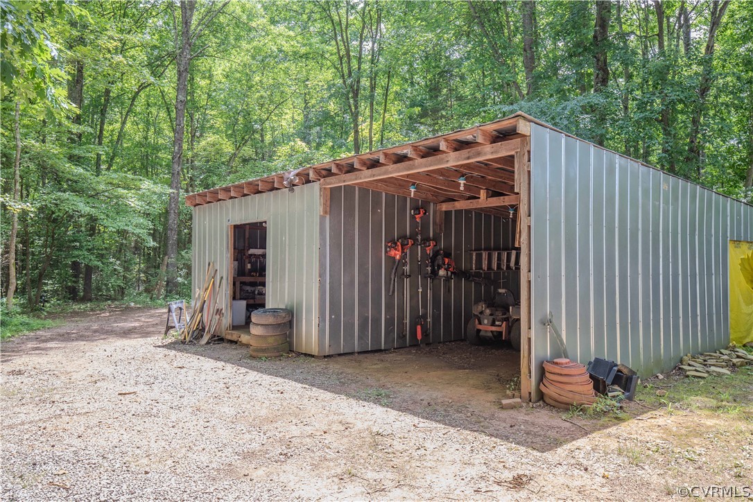 9910 Colemans Lake Road Ford, VA 23850 - Photo 28 of 33 a view of a backyard with wooden fence and large trees