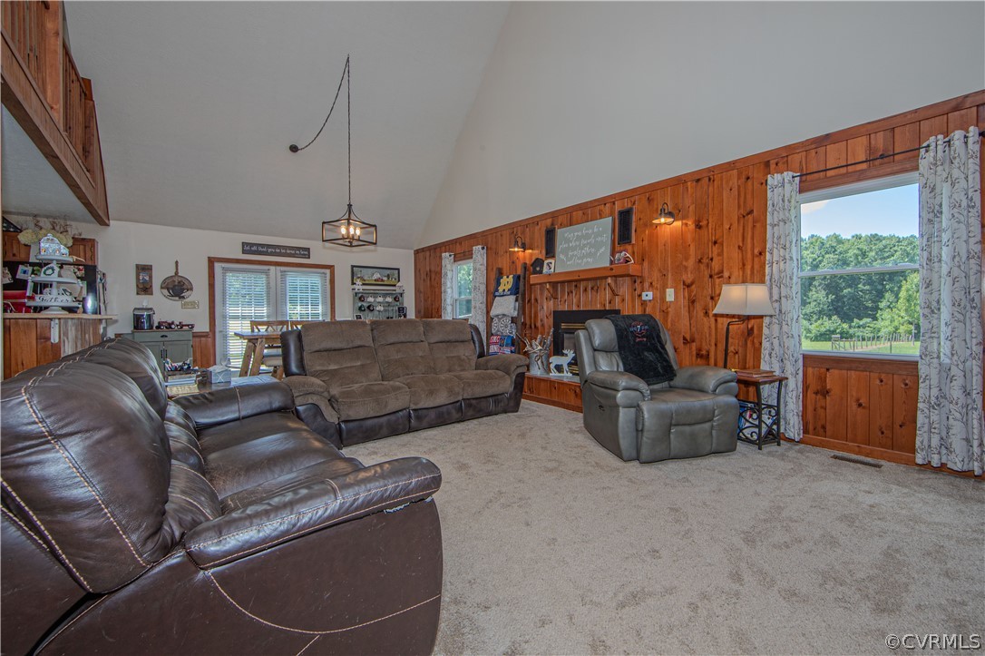 9910 Colemans Lake Road Ford, VA 23850 - Photo 8 of 33 a living room with furniture and a large window