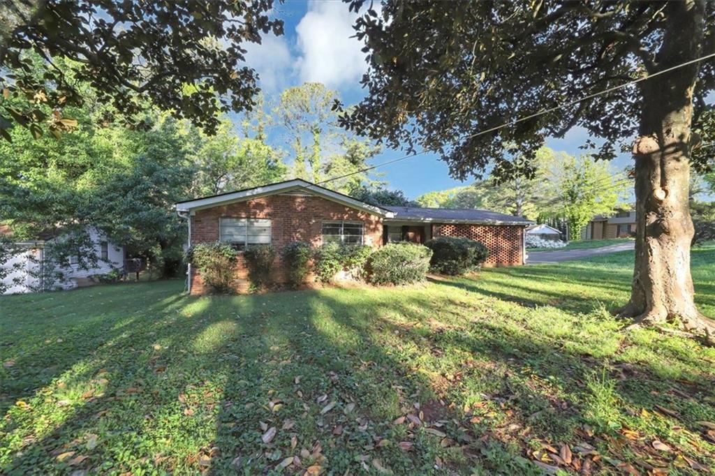 3355 Wesley Chapel Road Decatur, GA 30034 - Photo 1 of 1 a view of a house with a yard