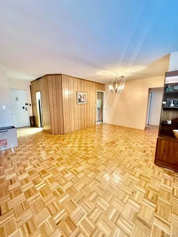 a view of a livingroom with kitchen and furniture