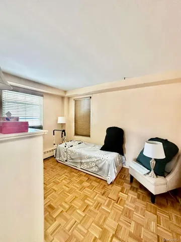 a bedroom with a bed and a couch