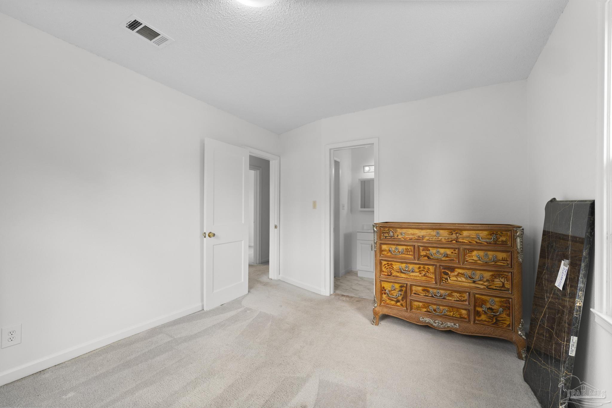 208 Berry Road Pensacola, FL 32507 - Photo 31 of 41 a view of an empty room with furniture and wooden floor