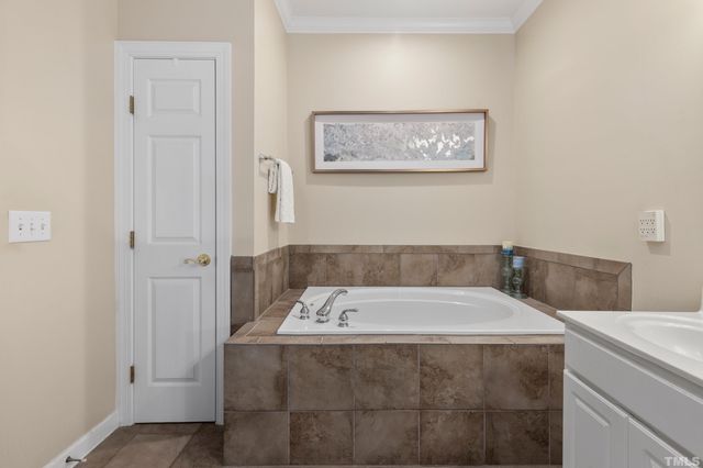 a bath tub sitting next to a bathroom