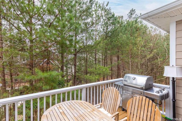 a view of a deck with mountain view and wooden floor