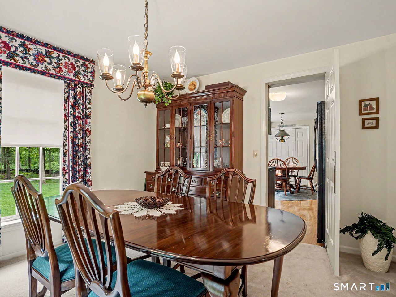 86 Fire Hill Road Redding, CT 06896 - Photo 13 of 36 a view of a dining room with furniture window and outside view