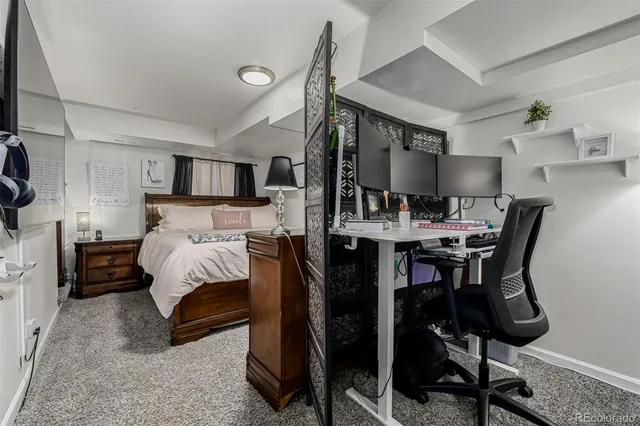 a bed room with a bed and furniture