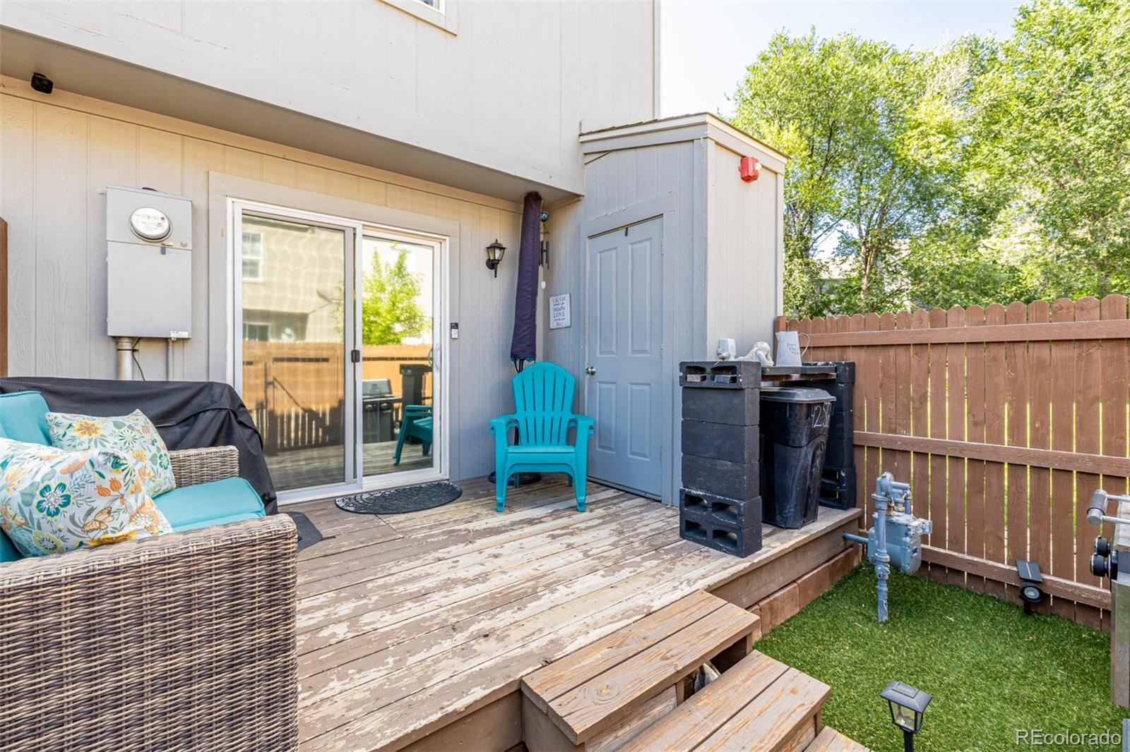 4282 Charleston Drive Colorado Springs, CO 80916 - Photo 25 of 50 a view of a deck with chair and front door