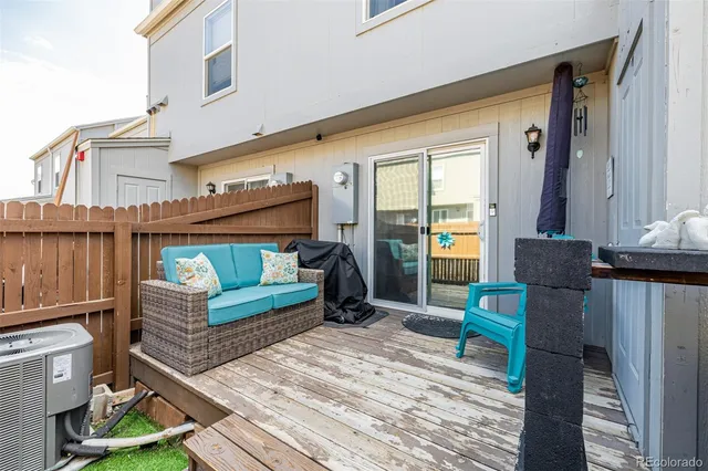 a view of a two chairs in the patio