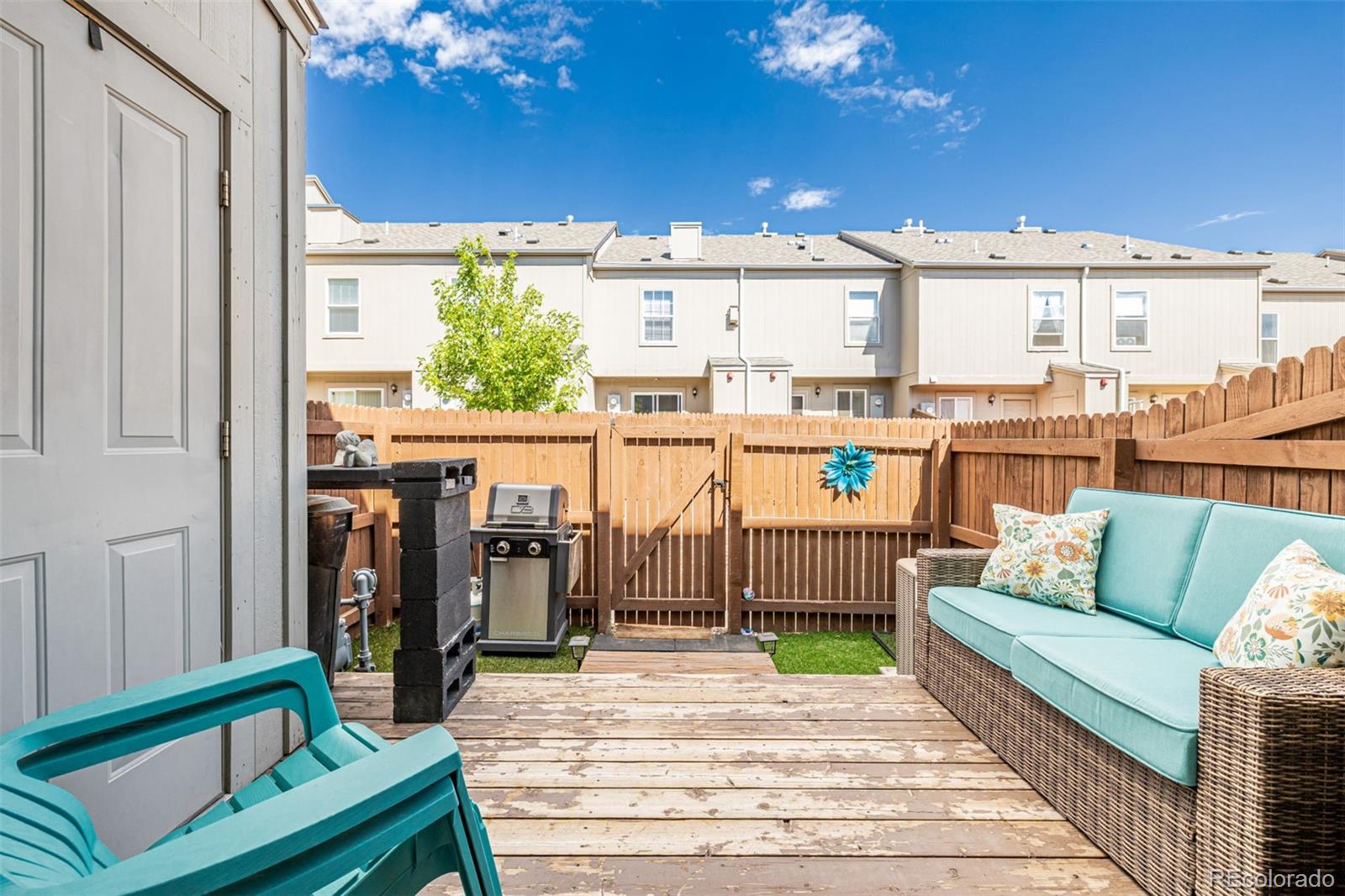 4282 Charleston Drive Colorado Springs, CO 80916 - Photo 27 of 50 a view of a balcony with furniture and a potted plant