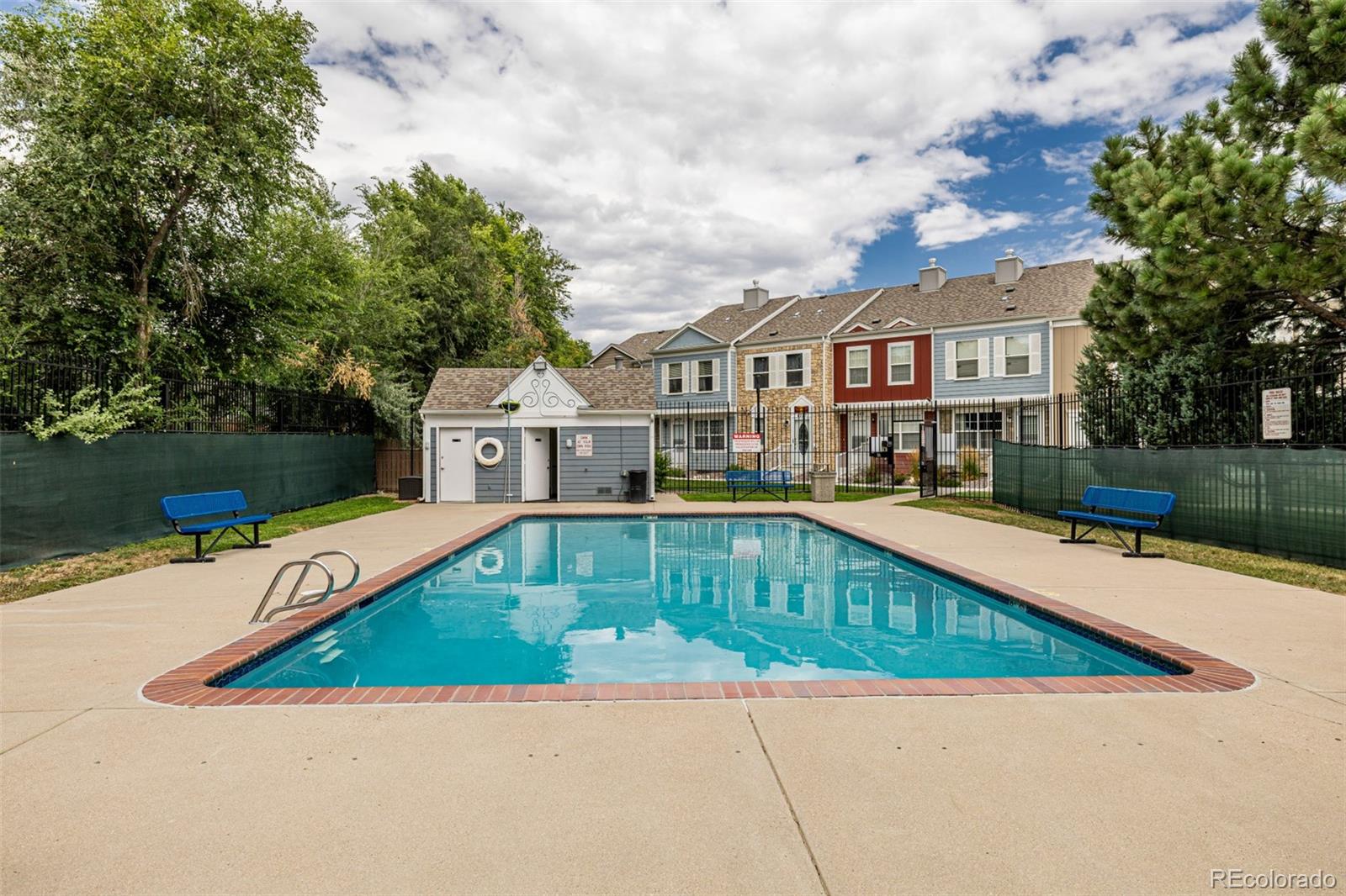 4282 Charleston Drive Colorado Springs, CO 80916 - Photo 33 of 50 a view of a house with a swimming pool