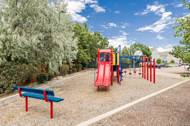 a view of a park with swings and slides