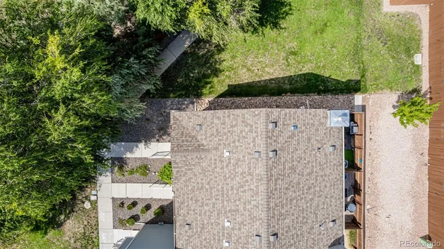 an aerial view of residential house with outdoor space