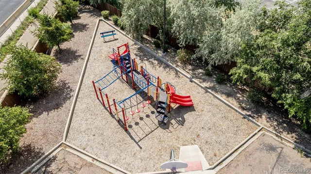 an aerial view of a tennis ground with large trees