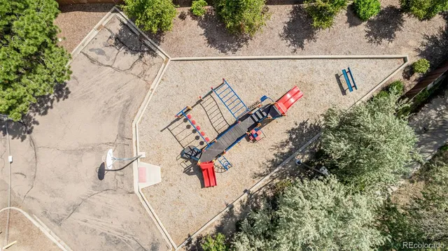 an aerial view of a house with a yard and a garage