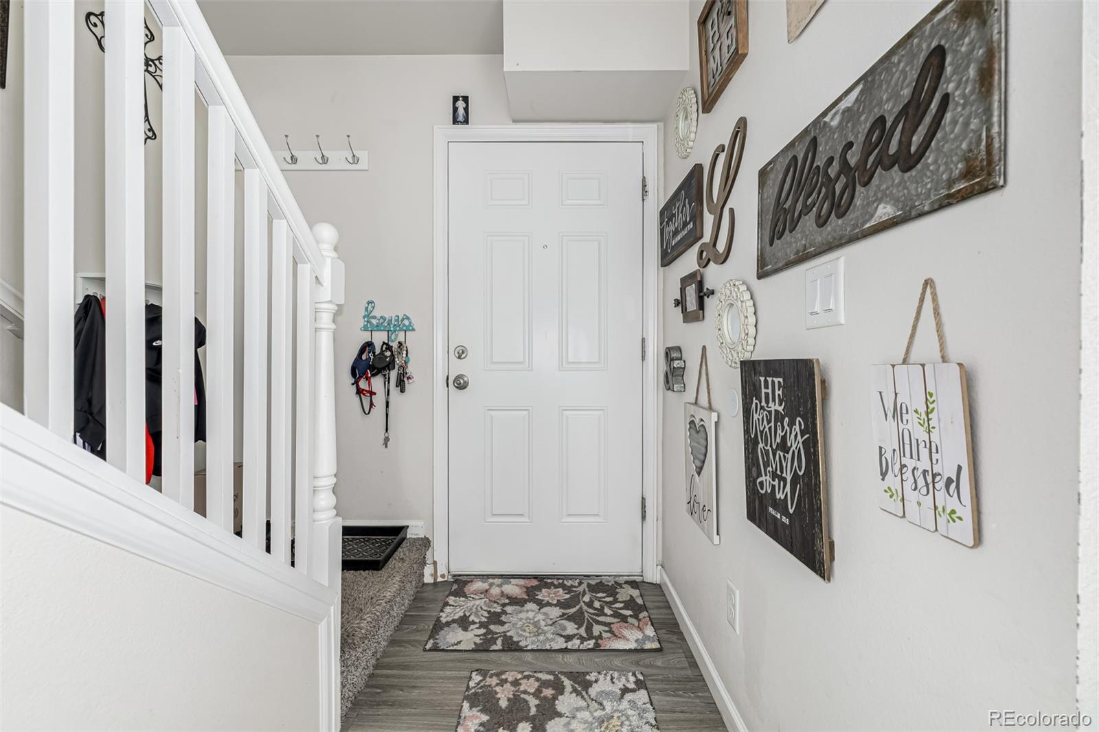 4282 Charleston Drive Colorado Springs, CO 80916 - Photo 5 of 50 a view of a hallway with windows and stairs