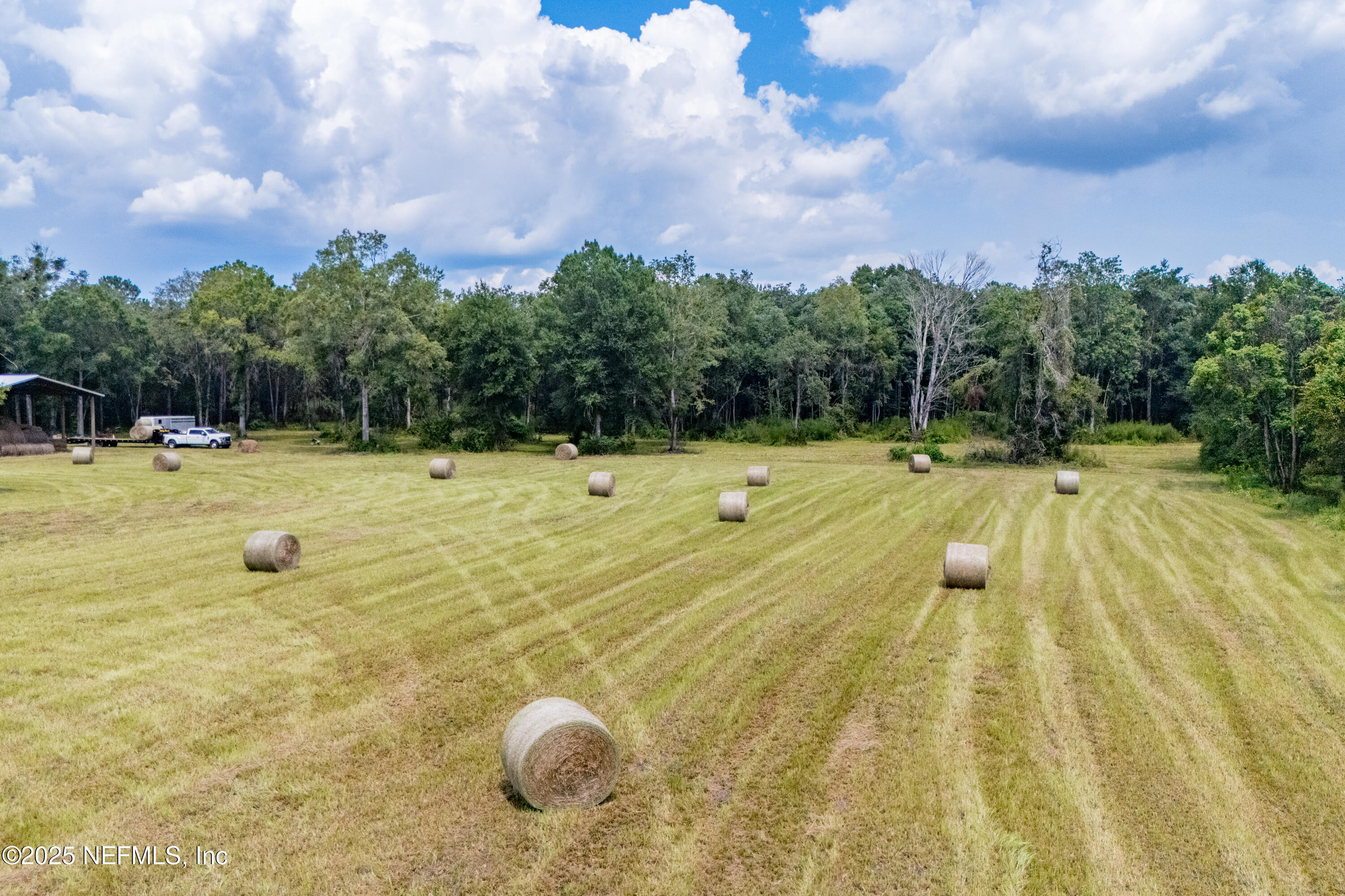 Tbd Northwest 185th Street Starke, FL 32091 - Photo 4 of 9 a view of a swimming pool with an outdoor space and seating area