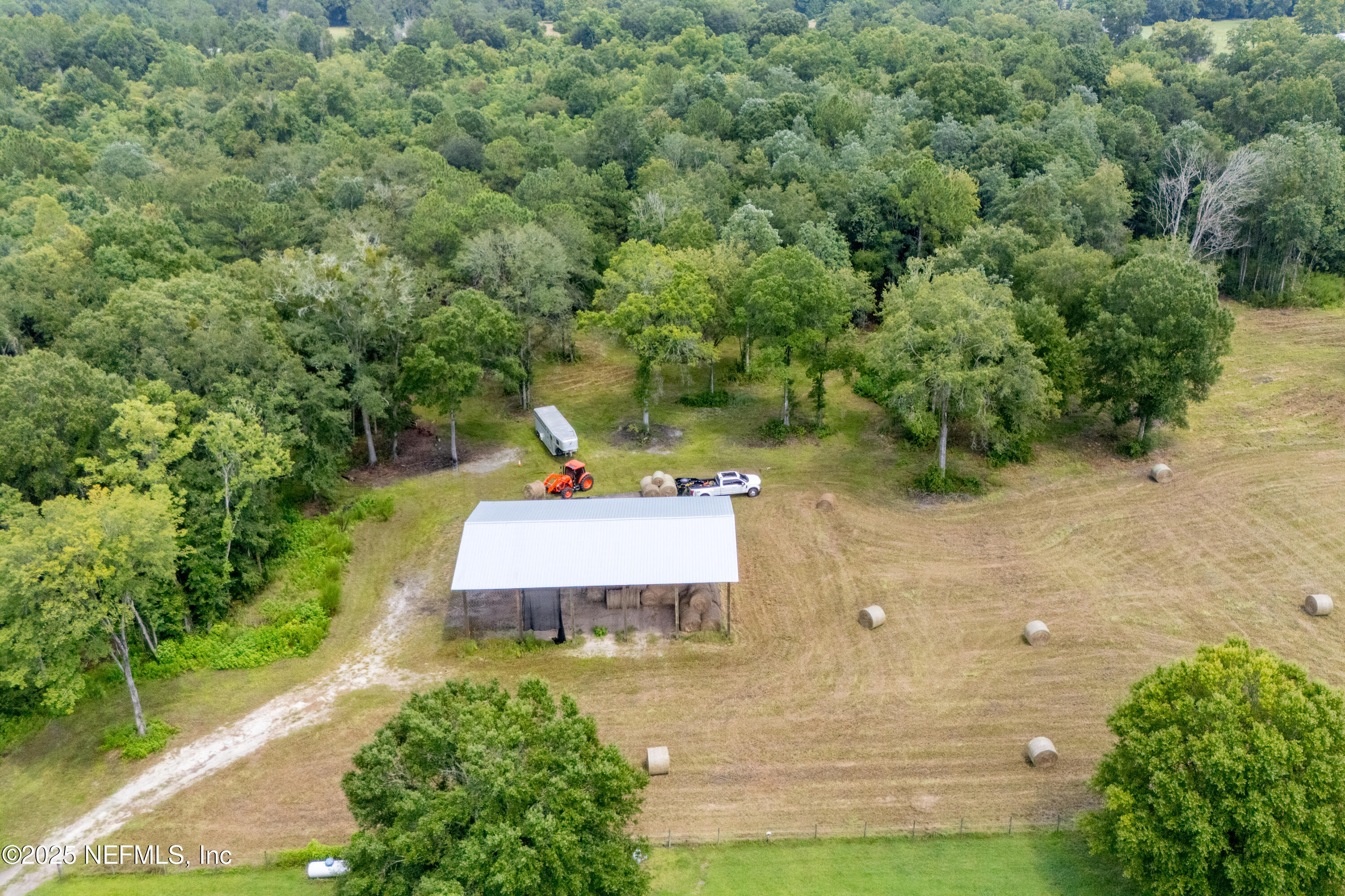 Tbd Northwest 185th Street Starke, FL 32091 - Photo 5 of 9 an aerial view of a house with a yard and lake view