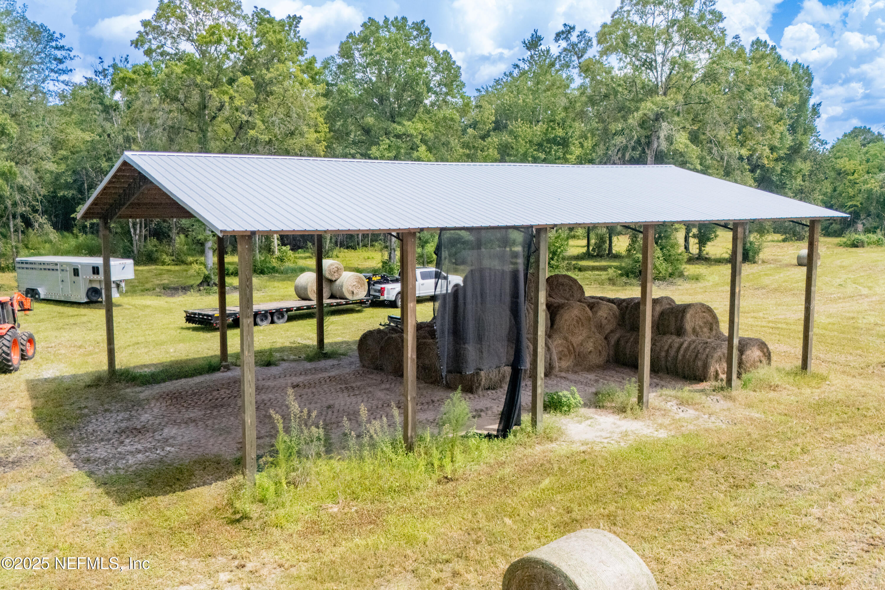Tbd Northwest 185th Street Starke, FL 32091 - Photo 9 of 9 a backyard of a house with yard table and chairs