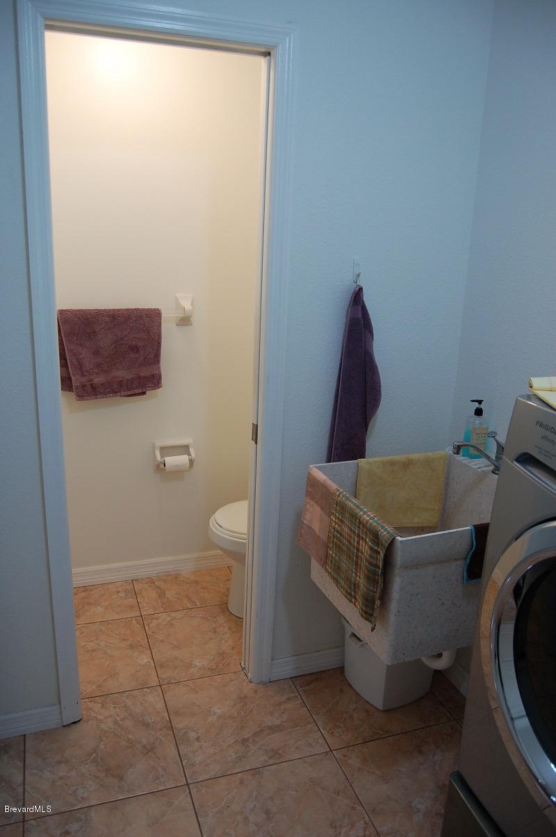 4541 Mustang Road Melbourne, FL 32934 - Photo 38 of 61 Laundry half bath