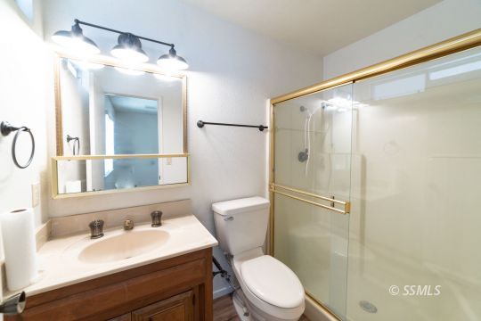 405 South Fountain Street Ridgecrest, CA 93555 - Photo 11 of 24 a bathroom with a sink toilet and shower