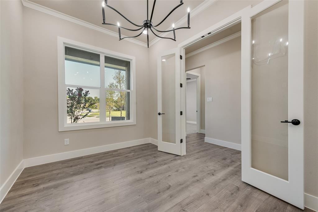 1323 Selby Road Van Alstyne, TX 75495 - Photo 16 of 38 a view of hallway with window and wooden floor