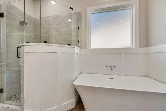 a bathroom with a bathtub and a sink