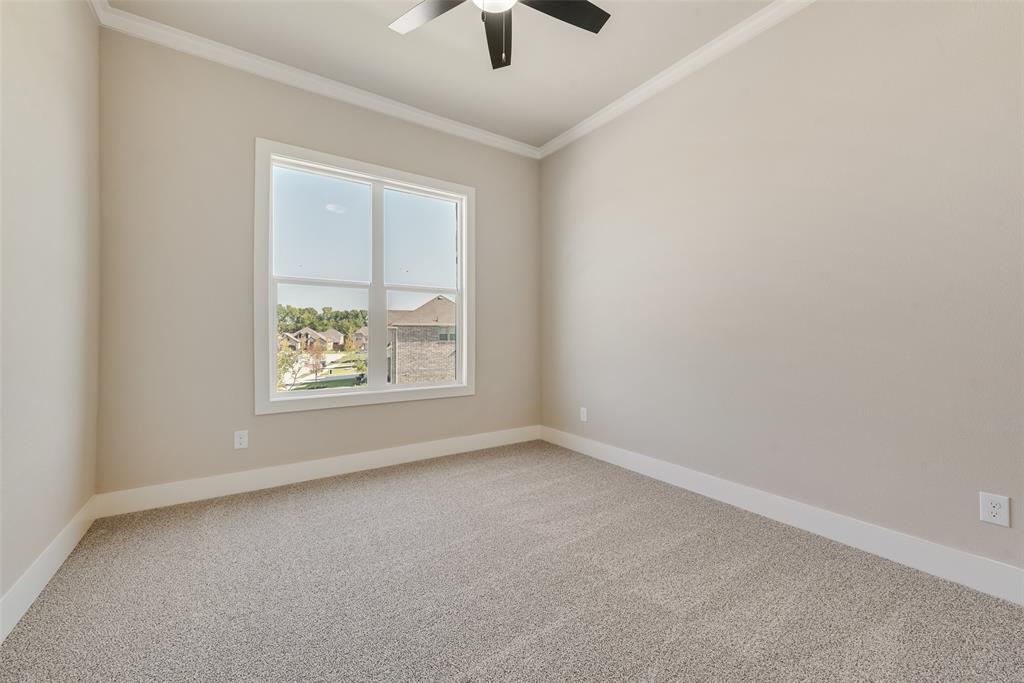 1323 Selby Road Van Alstyne, TX 75495 - Photo 31 of 38 an empty room with a window and a ceiling fan