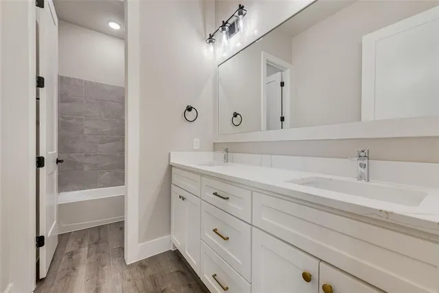 a bathroom with a bathtub and a sink