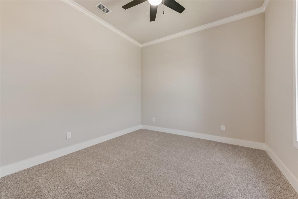 1323 Selby Road Van Alstyne, TX 75495 - Photo 33 of 38 an empty room with a ceiling fan and window