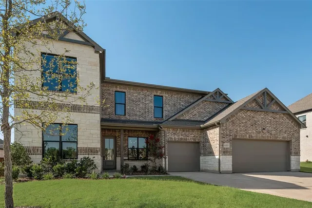 front view of a house with a garden