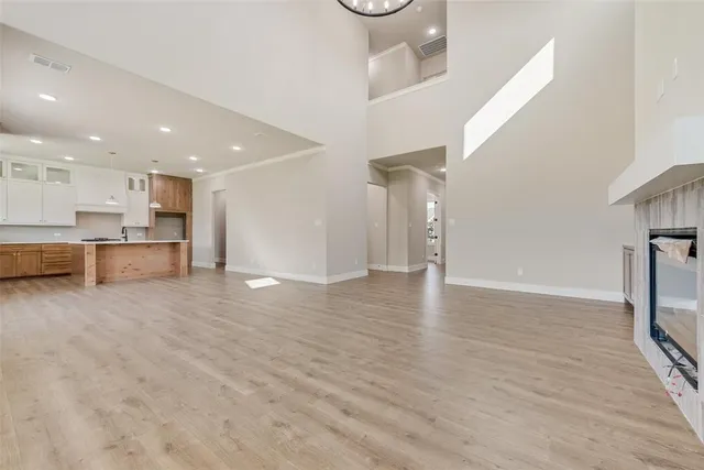 a view of a kitchen with a sink and a refrigerator