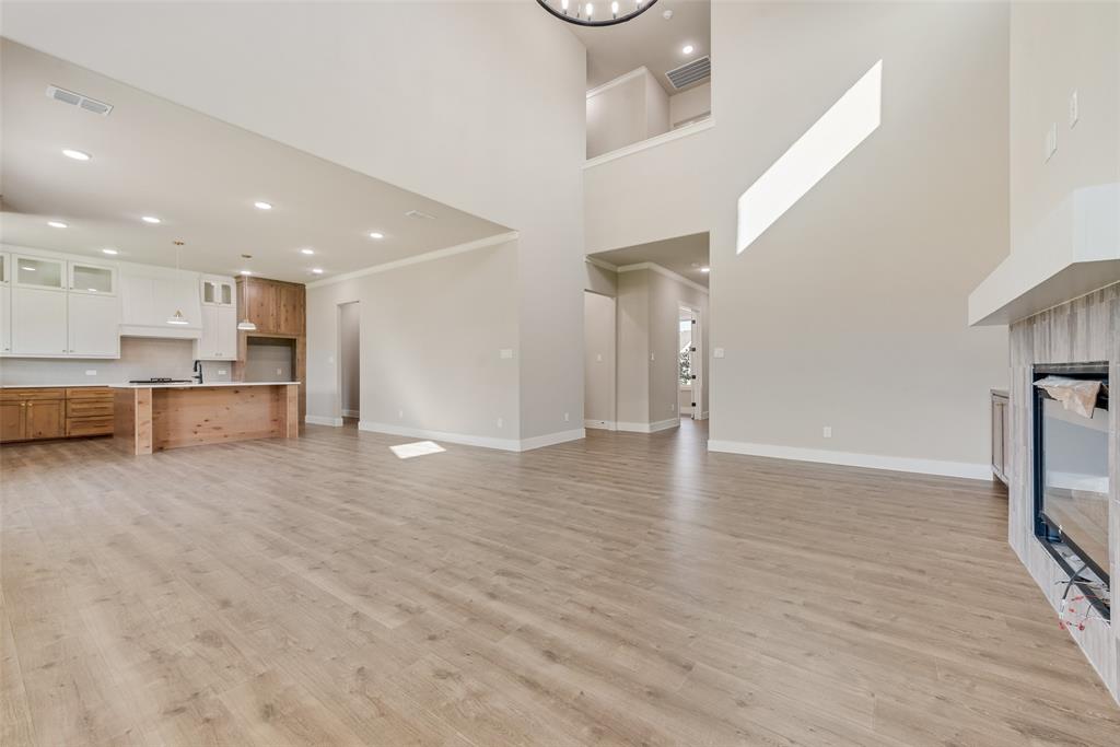 1323 Selby Road Van Alstyne, TX 75495 - Photo 5 of 38 a view of a kitchen with a sink and a refrigerator